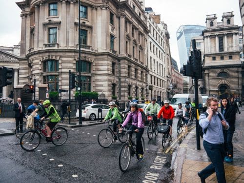 people commuting to work on bicycles